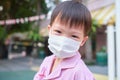 Little Asian toddler boy child wearing protective medical mask at school, Concept of coronavirus quarantines and Air pollution pm2
