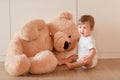 Cute little baby boy with big teddy bear Royalty Free Stock Photo