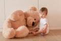 Cute little baby boy with big teddy bear Royalty Free Stock Photo