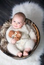 Cute little baby boy with handmade knitted cloths, playing with Royalty Free Stock Photo