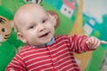 Cute little baby boy lying on his back smiling Royalty Free Stock Photo