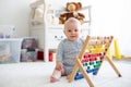 Cute little baby boy, playing with abacus at home Royalty Free Stock Photo