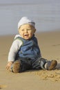 Cute little baby boy playing on the beach Royalty Free Stock Photo