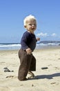 Cute little baby boy running on the beach Royalty Free Stock Photo