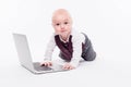 Cute little baby boy sitting on a white background in front of a Royalty Free Stock Photo