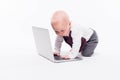 Cute little baby boy sitting on a white background in front of a Royalty Free Stock Photo