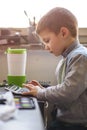 Cute little baby boy using a calculator Royalty Free Stock Photo