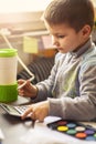 Cute little baby boy using a calculator Royalty Free Stock Photo