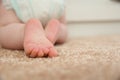 Cute little baby crawling on carpet, closeup with space for text Royalty Free Stock Photo