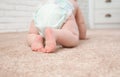 Cute little baby crawling on carpet indoors Royalty Free Stock Photo