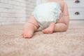 Cute little baby crawling on carpet indoors Royalty Free Stock Photo