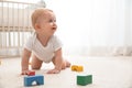 Cute little baby crawling on carpet indoors Royalty Free Stock Photo