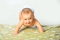 Cute little baby in diaper. Laughing baby. Nursery for children. Kid playing in bed. Baby portrait on white background Royalty Free Stock Photo