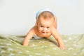 Cute little baby in diaper. Laughing baby. Nursery for children. Kid playing in bed. Baby portrait on white background Royalty Free Stock Photo