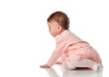Cute little baby girl creeping on white background Royalty Free Stock Photo