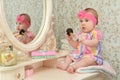 Cute little baby girl in front of mirror Royalty Free Stock Photo