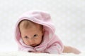 Cute little baby girl in pink bathrobe Royalty Free Stock Photo