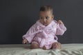 Baby girl on bed in bathrobe Royalty Free Stock Photo