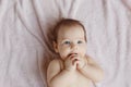Cute little baby lying on bed, top view Royalty Free Stock Photo