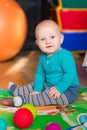 Cute little baby playing with colorful toys Royalty Free Stock Photo