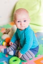 Cute little baby playing with colorful toys Royalty Free Stock Photo