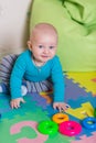 Cute little baby playing with colorful toys Royalty Free Stock Photo