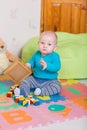 Cute little baby playing with colorful toys Royalty Free Stock Photo