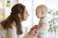 Cute little baby plays with his young mom Royalty Free Stock Photo