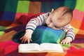 Cute little baby reading book Royalty Free Stock Photo