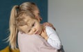 Cute little baby sleeps sweetly on mom's shoulder Royalty Free Stock Photo