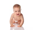 Cute little baby with evil smile crawling on floor Royalty Free Stock Photo