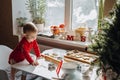 Cute little baby toddler girl making christmas cookies in home kitchen and play with dough. Mother and little girl Royalty Free Stock Photo