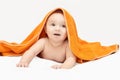 Cute little baby. Under bath towel. Happy kid portrait. White background Royalty Free Stock Photo