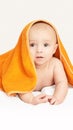 Cute little baby. Under bath towel. Happy kid portrait. White background Royalty Free Stock Photo