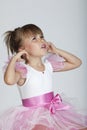 Cute little ballerina angry about the loud noise Royalty Free Stock Photo