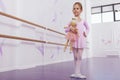 Cute little ballerina girl exercising at dance school Royalty Free Stock Photo
