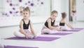Cute little ballerinas stretching together at dancing school. Adorable little girl exercising at dance school Royalty Free Stock Photo