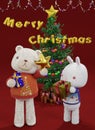 3D rendering illustration, rabbit and bear holding gifts standing in front of Christmas tree to celebrate merry christmas Royalty Free Stock Photo