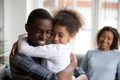 Cute little black girl embracing happy african american dad Royalty Free Stock Photo