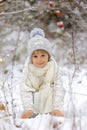 Cute little blond boy, playing in the snow on a winter day Royalty Free Stock Photo