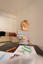 Cute little blonde boy drawing with color pencils Royalty Free Stock Photo