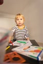 Cute little blonde boy drawing with colored pencils Royalty Free Stock Photo