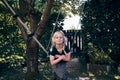 Smiling little girl playing on a tree swing outdoors Royalty Free Stock Photo