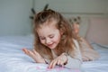 Cute little blue-eyed girl holds pink little hearts in her hands. Happy child gives a gift to his mother. Birthday. Mothers Day Royalty Free Stock Photo