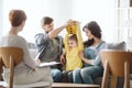 Cute little boy with ADHD during session with professional therapist