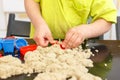 Cute little boy age of 3 years plays kinetic sand at home Royalty Free Stock Photo