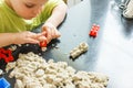 Cute little boy age of 3 years plays kinetic sand at home Royalty Free Stock Photo