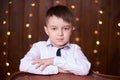 Cute little boy. Beautiful portrait. Brown background Royalty Free Stock Photo