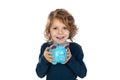 Cute little boy with a blue moneybox Royalty Free Stock Photo