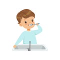 Cute little boy brushing his teeth, kid caring for teeth in bathroom vector Illustration on a white background Royalty Free Stock Photo